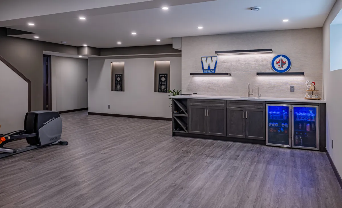 Basement rec room with wet bar and home gym