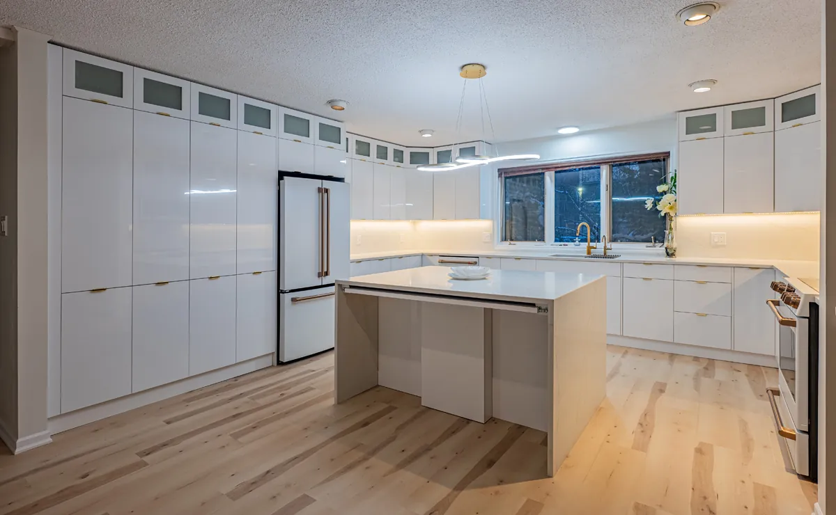 High-gloss white kitchen with island